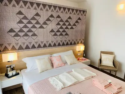 Letto o letti in una camera di Relais del Borgo- Domo