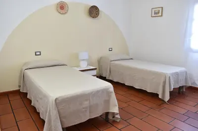 Letto o letti in una camera di Sardegna23 - Appartamento Vacanze -