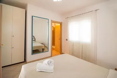 Letto o letti in una camera di Le Dune