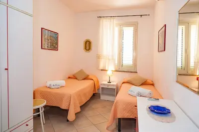Letto o letti in una camera di Le Dune