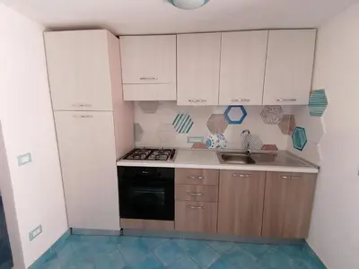 Cucina o angolo cottura di Appartamento centralissimo in San Teodoro