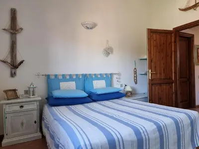 Letto o letti in una camera di LA COLLINETTA