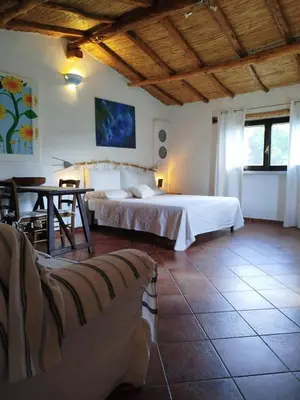 Letto o letti in una camera di La Casetta