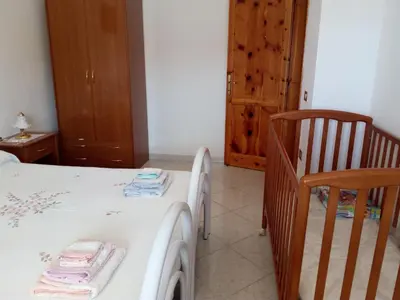 Letto o letti in una camera di Santu Luisu