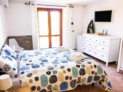 Letto o letti in una camera di B&B Tavolara