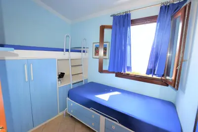 Letto o letti in una camera di Domo de Mari