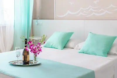 Letto o letti in una camera di La Smeralda - Boutique Rooms and Breakfast