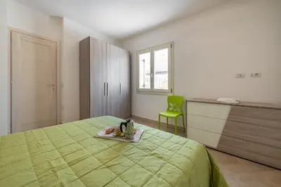 Letto o letti in una camera di CASA ALESSANDRA CALA GONONE