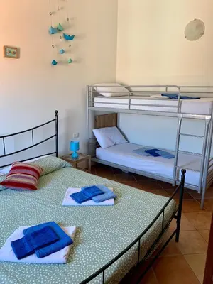 Letto o letti in una camera di Sardegna Appartamento Posada