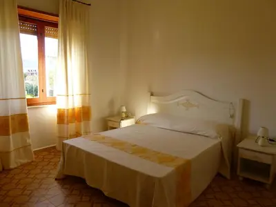 Letto o letti in una camera di Su Poeta