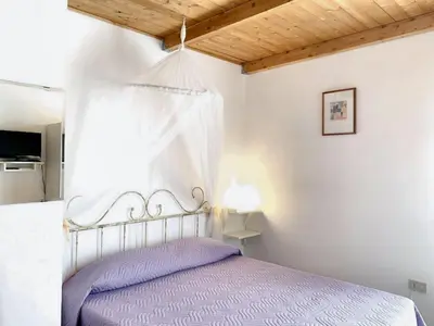 Letto o letti in una camera di Charming Apartment in Galtellì