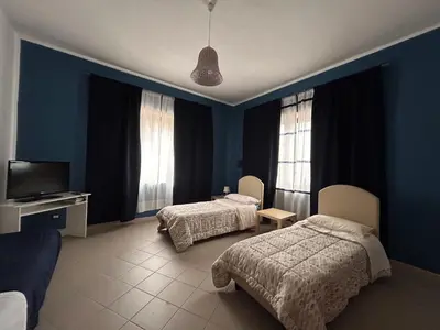 Letto o letti in una camera di MARY HOUSE