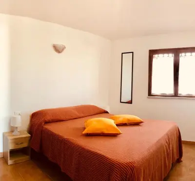 Letto o letti in una camera di Siniscola Casa vacanze Olmo