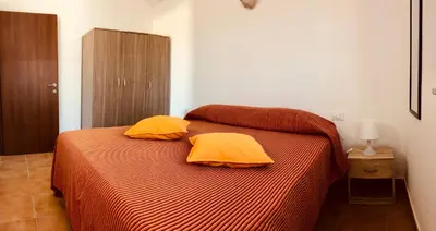 Letto o letti in una camera di Siniscola Casa vacanze Olmo