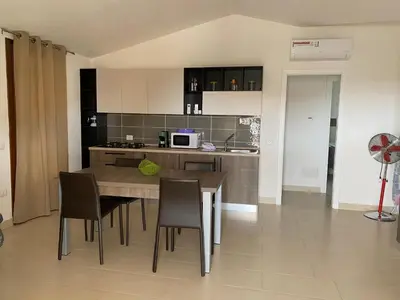 Cucina o angolo cottura di appartamento con terrazza in villetta