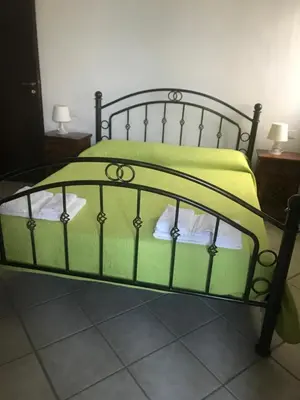 Letto o letti in una camera di Affittacamere Peonia