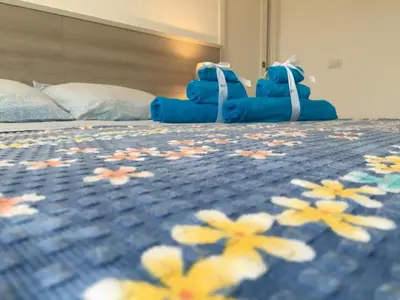 Letto o letti in una camera di Perla
