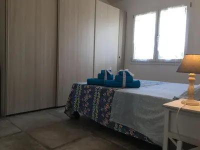 Letto o letti in una camera di Perla