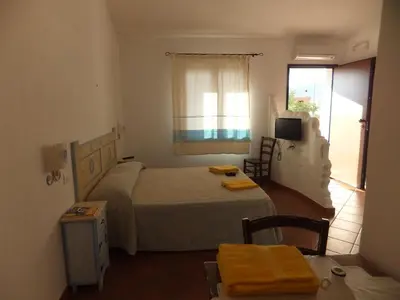Letto o letti in una camera di Grazia Deledda