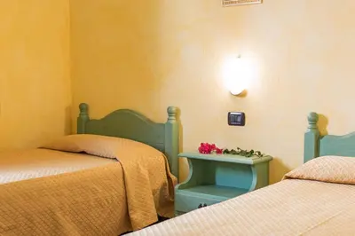 Letto o letti in una camera di Camere Magnolia