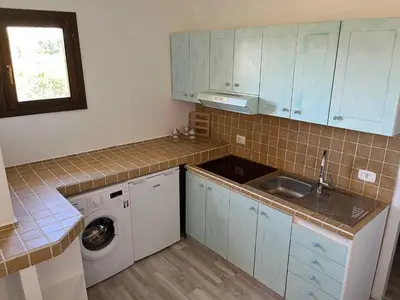 Cucina o angolo cottura di Porto Coda Cavallo Salina Bamba