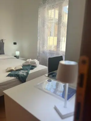 Letto o letti in una camera di Il Canarino affittacamere