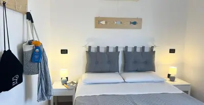 Letto o letti in una camera di Il Canarino affittacamere