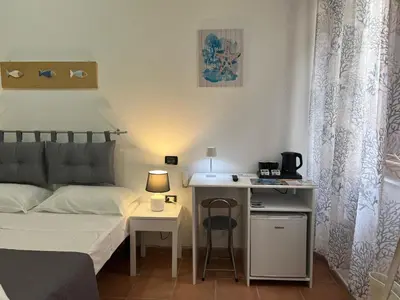 Letto o letti in una camera di Il Canarino affittacamere