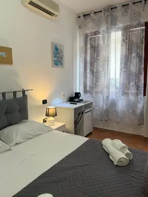 Letto o letti in una camera di Il Canarino affittacamere
