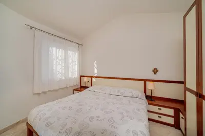 Letto o letti in una camera di Villa Adele, con piscina a 700 mt dal mare