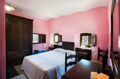 Letto o letti in una camera di Castello Malicas