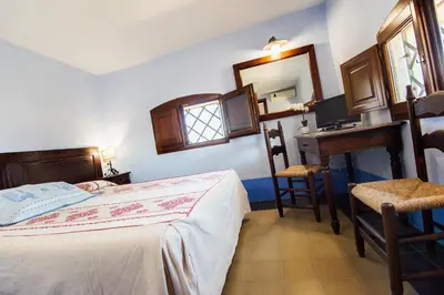 Letto o letti in una camera di Castello Malicas