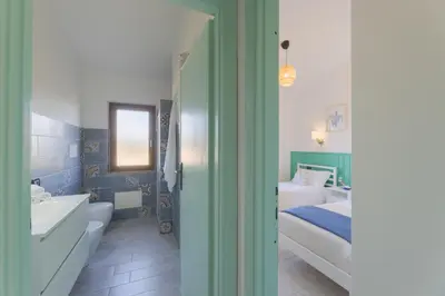 Letto o letti in una camera di Appartamenti Le Magnolie