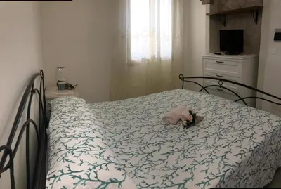 Letto o letti in una camera di Villa Pusortu