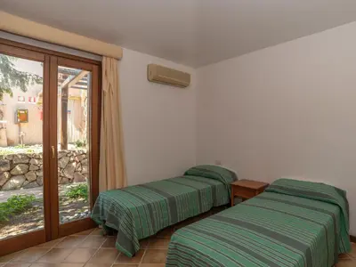 Letto o letti in una camera di Holiday Home Corbezzolo 10 - Vista Village by Interhome