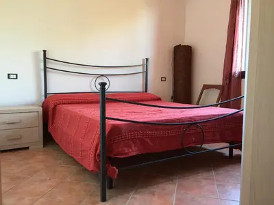 Letto o letti in una camera di Domo Giulia