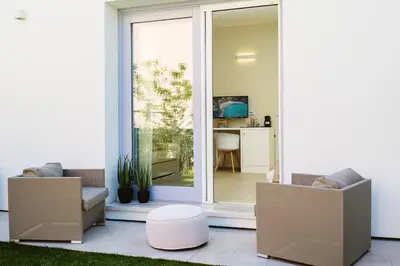 TV o dispositivi per l'intrattenimento presso Enjoy Your Stay - Guest House - Olbia