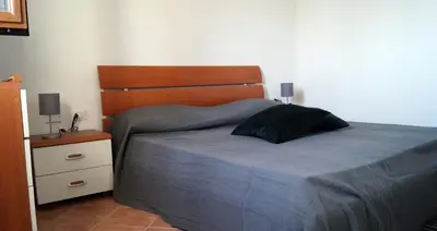 Letto o letti in una camera di Domo Sara