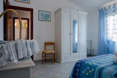 Letto o letti in una camera di Appartamenti Costa - BUDONI SWEET HOME