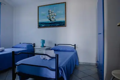 Letto o letti in una camera di Appartamenti Costa - BUDONI SWEET HOME