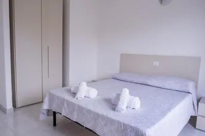 Letto o letti in una camera di Residenze Gambaru