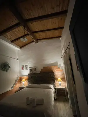 Letto o letti in una camera di B&B Corte San Lussorio
