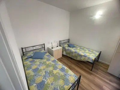 Letto o letti in una camera di Villa Paola San Teodoro con piscina privata