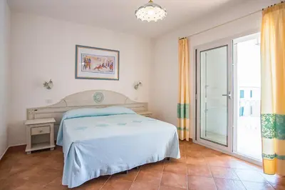 Letto o letti in una camera di Le Residenze di Via Leonardo da Vinci 14