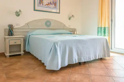 Letto o letti in una camera di Le Residenze di Via Leonardo da Vinci 14