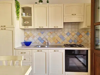 Cucina o angolo cottura di Le Melodie - Appartamenti con spazi esterni privati a Sos Alinos