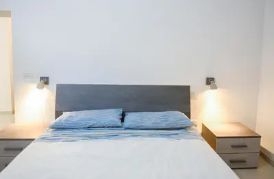 Letto o letti in una camera di Tatta & Nanna Apartment