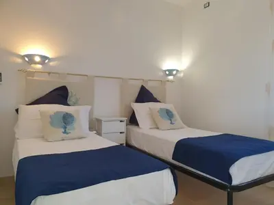 Letto o letti in una camera di Villino Turchese Budoni