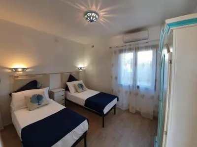 Letto o letti in una camera di Villino Turchese Budoni