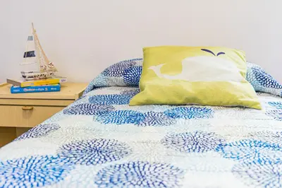 Letto o letti in una camera di Casa Goletta soggiorno per 4 a 2 minuti dalla spiaggia IUNQ0334